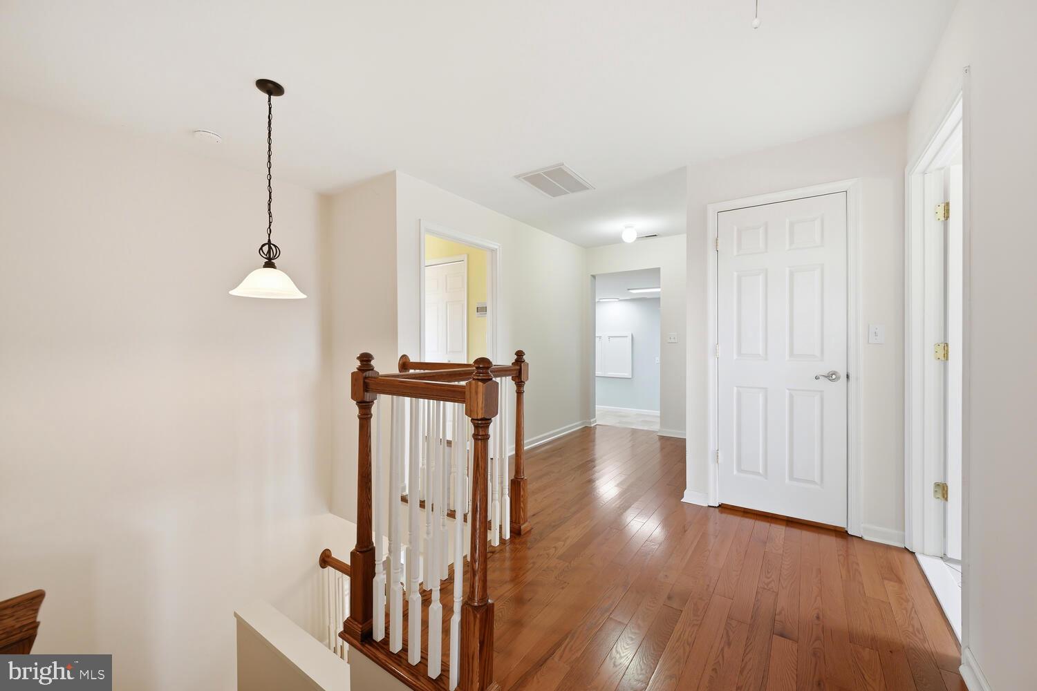 2576 Hoopers Island Road Fishing Creek, MD 21634 - Photo 21 of 43 a view of a room with wooden floor and a ceiling fan