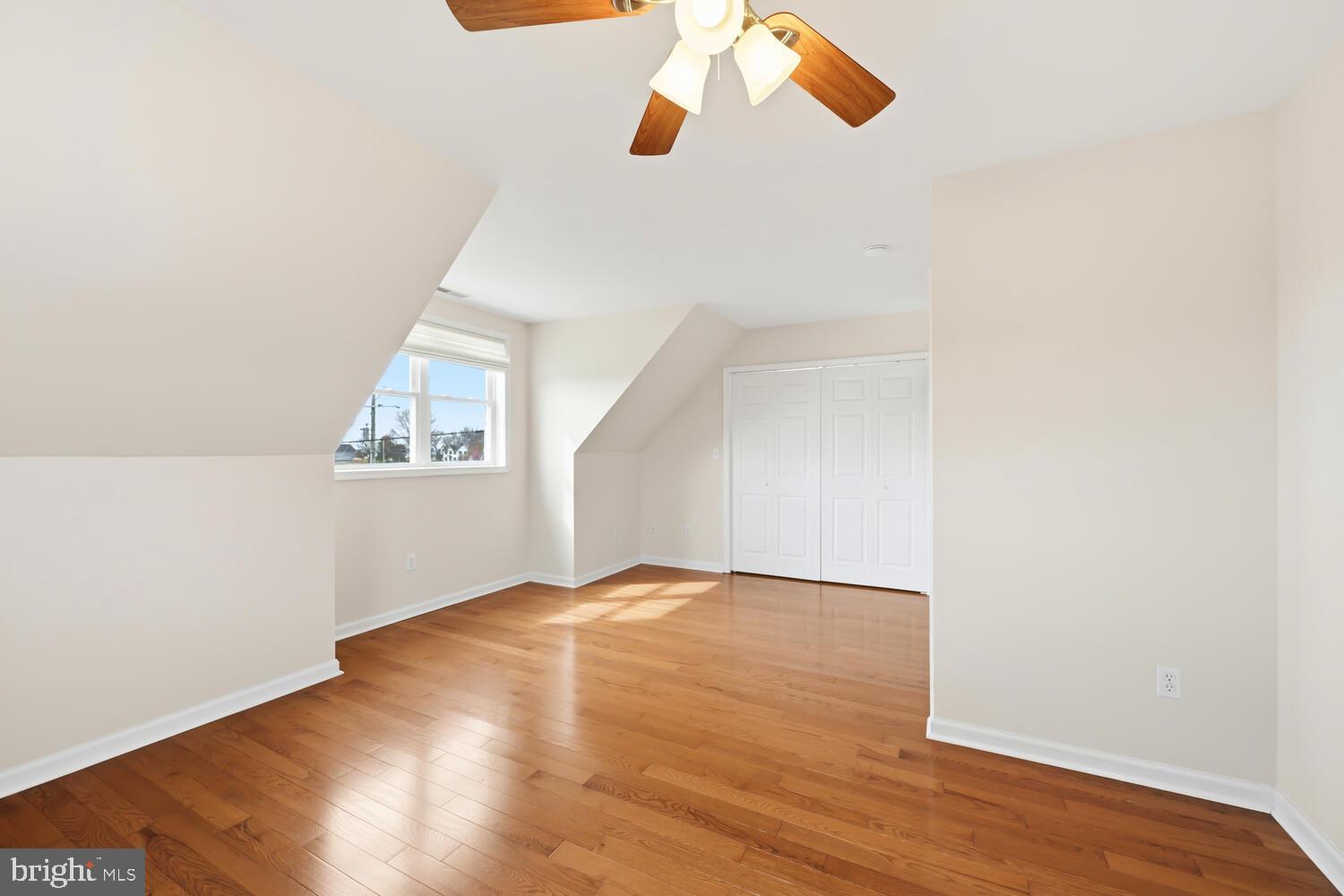 2576 Hoopers Island Road Fishing Creek, MD 21634 - Photo 25 of 43 an empty room with wooden floor cabinet and windows