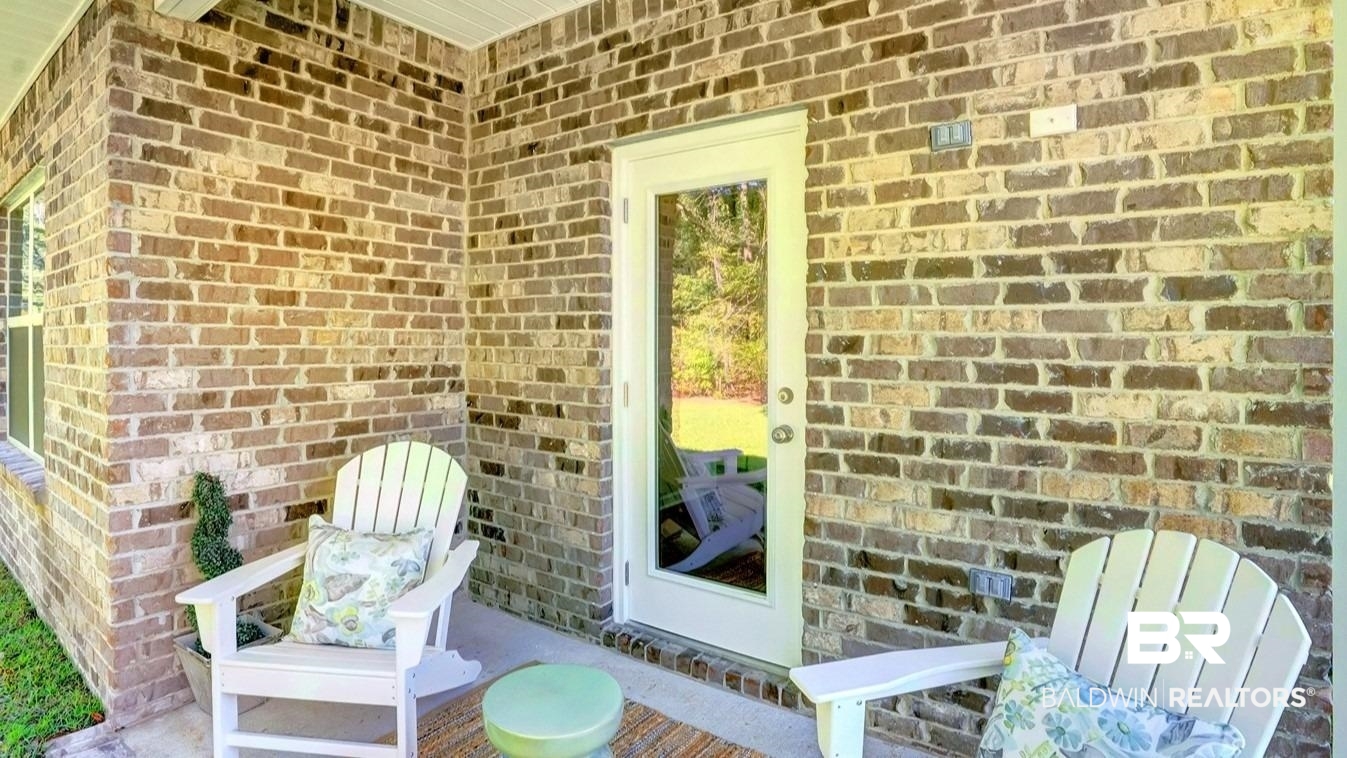 293 Hudson Loop Fairhope, AL 36532 - Photo 27 of 30 View of exterior entry featuring brick siding