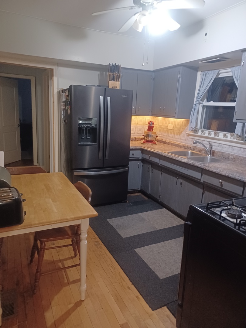 2005 Darrow Avenue Evanston, IL 60201 - Photo 11 of 23 a kitchen with kitchen island a counter top space cabinets and stainless steel appliances