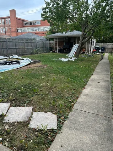 a view of a backyard with sitting area
