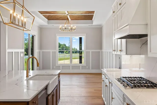 a white bath tub sitting next to a white wall