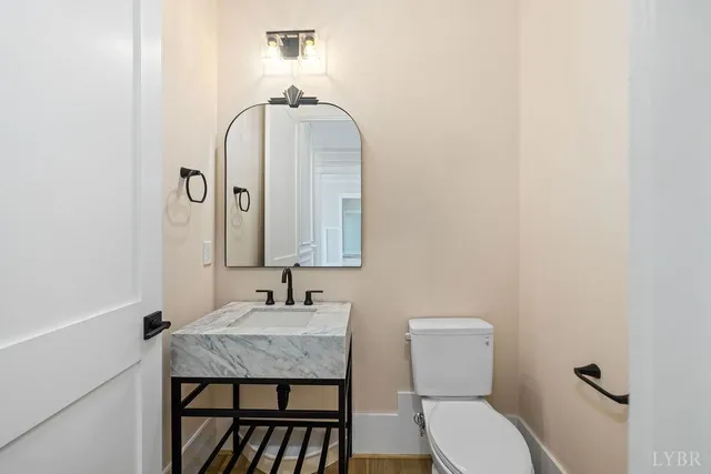 a view of a swimming pool with a patio and a garden