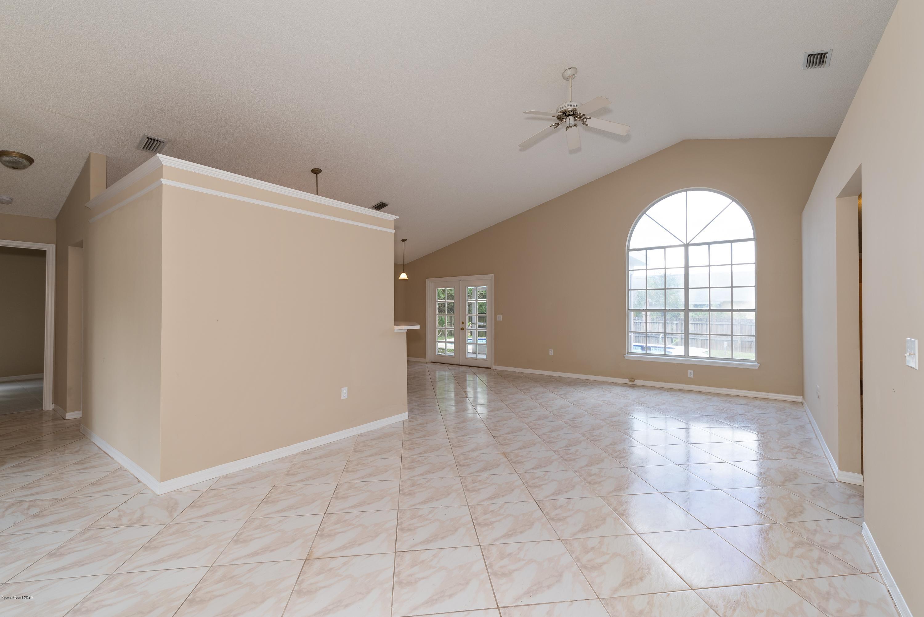 1208 Stadt Road Northwest Palm Bay, FL 32907 - Photo 2 of 24 a view of an empty room with a window
