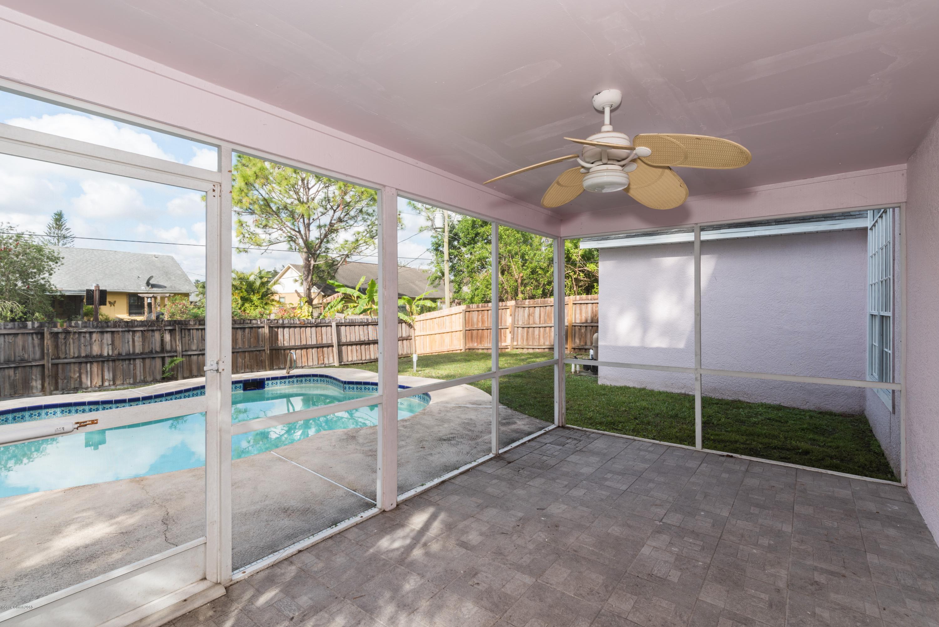 1208 Stadt Road Northwest Palm Bay, FL 32907 - Photo 20 of 24 a view of a porch with furniture and backyard