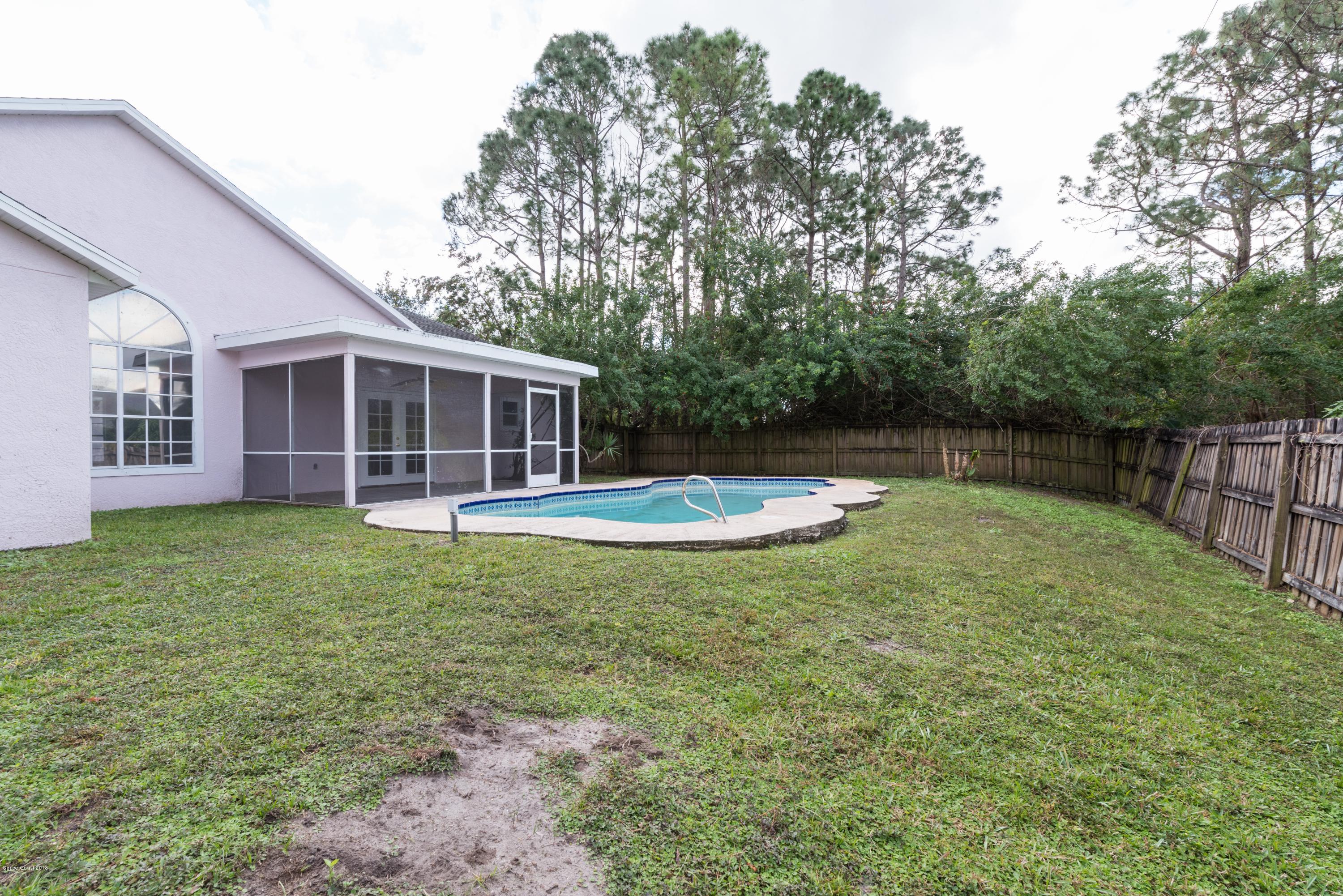 1208 Stadt Road Northwest Palm Bay, FL 32907 - Photo 23 of 24 a view of a house with backyard and porch