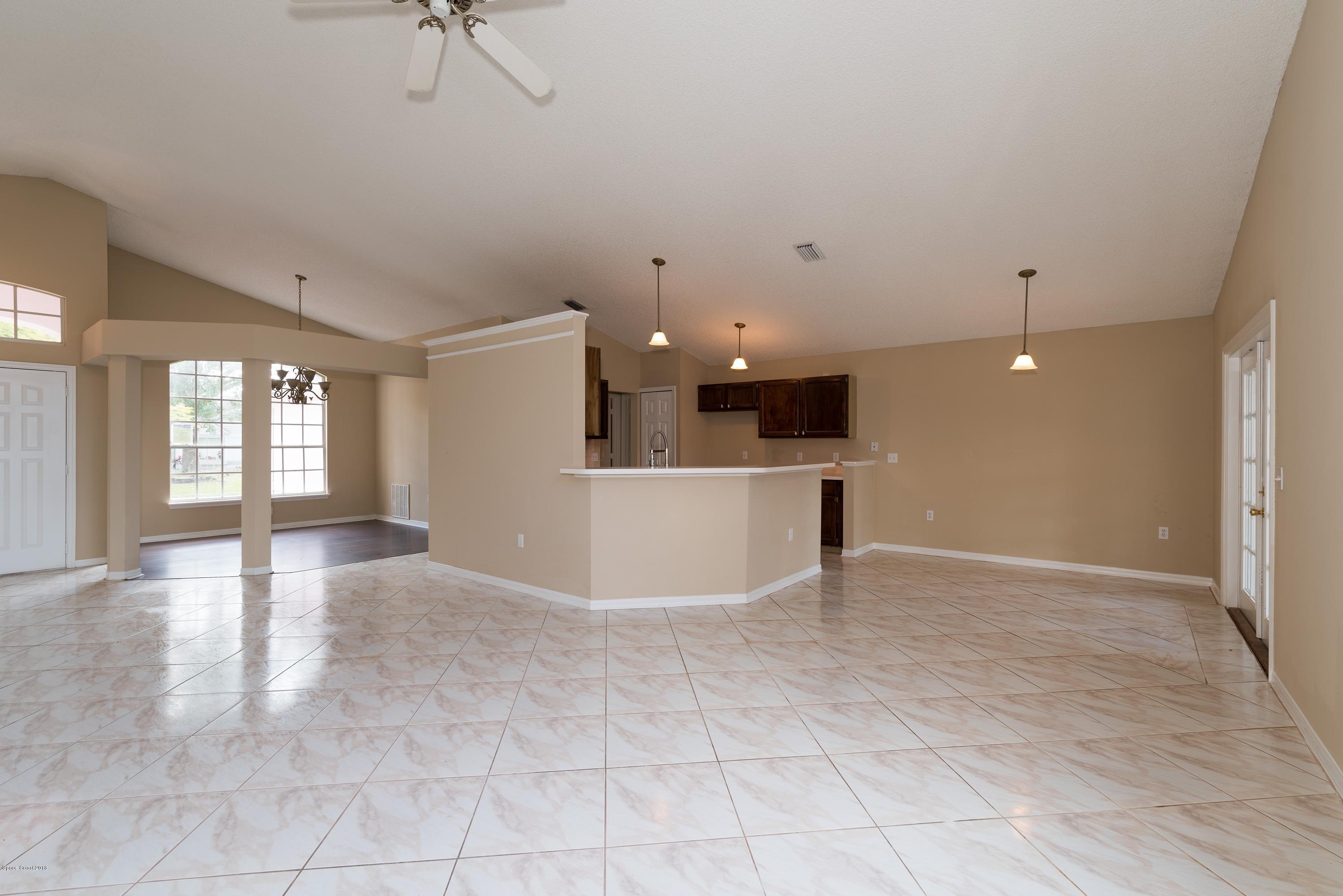 1208 Stadt Road Northwest Palm Bay, FL 32907 - Photo 7 of 24 a view of a kitchen with a sink and a window