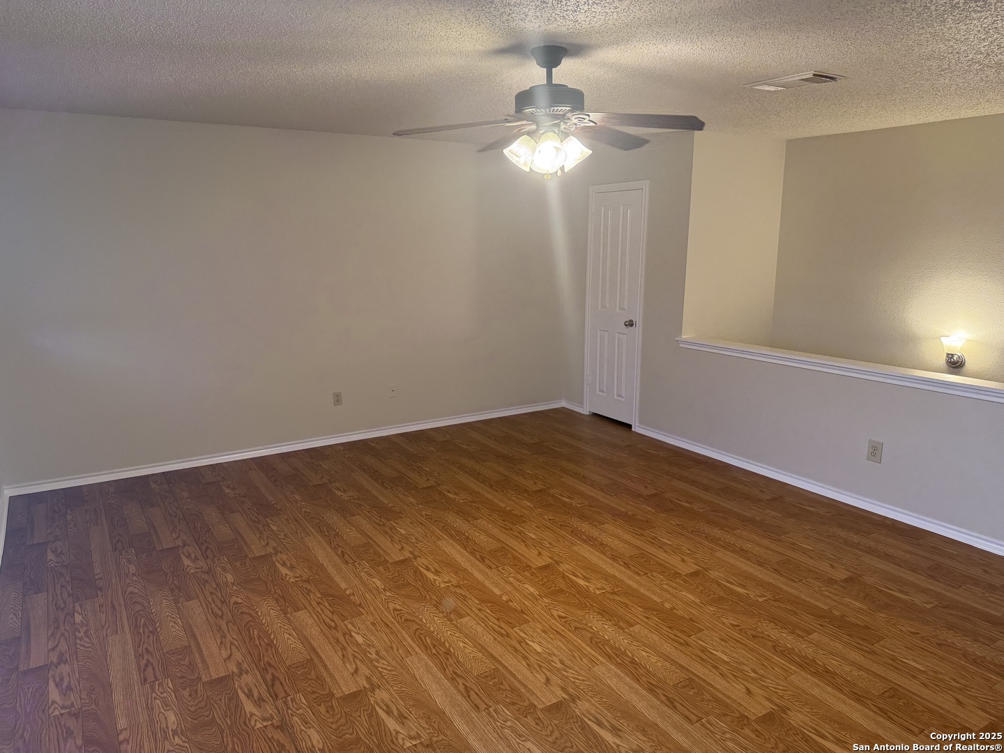 8022 Chestnut Clay Lane Converse, TX 78109 - Photo 11 of 21 wooden floor in an empty room