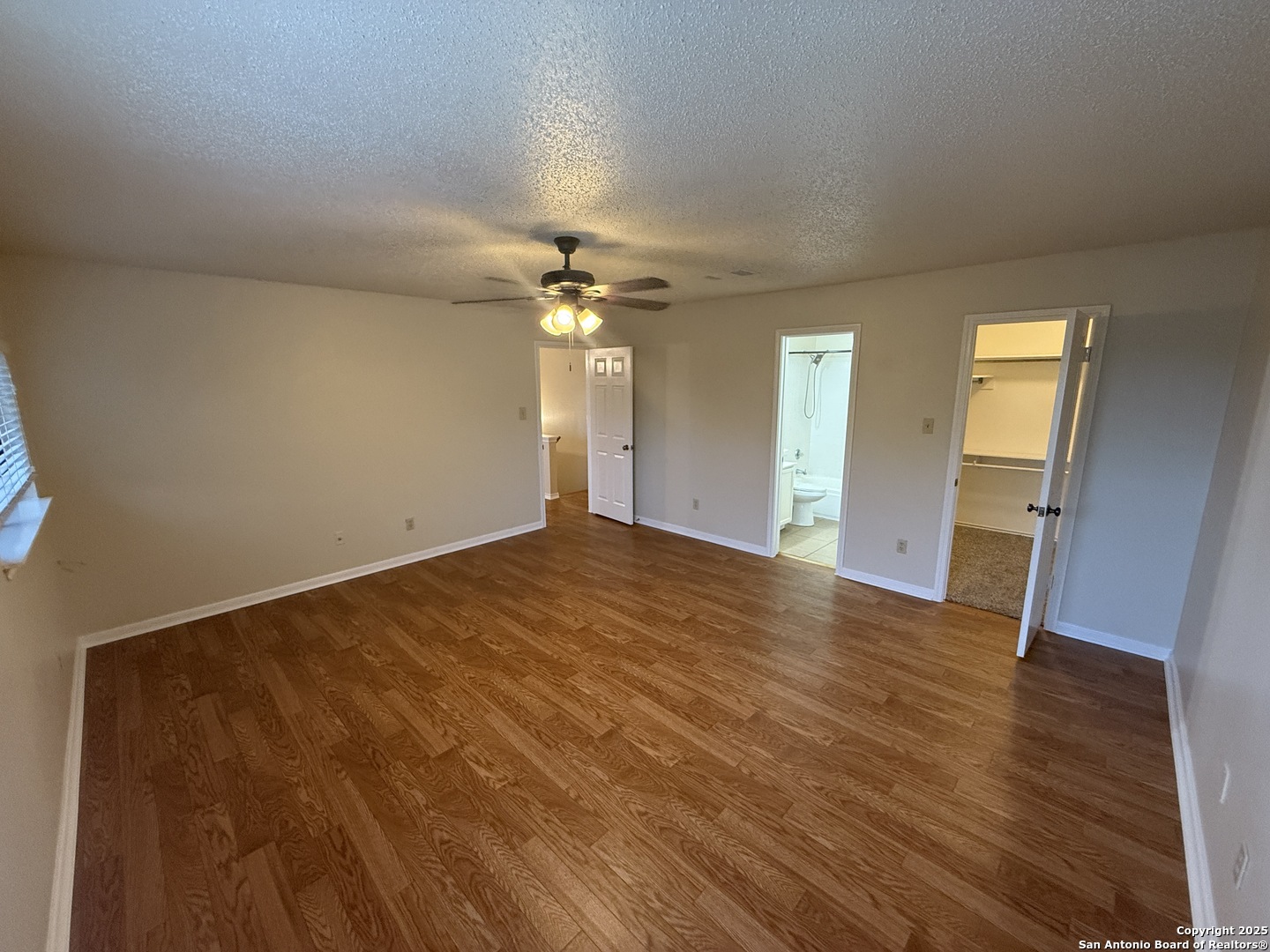 8022 Chestnut Clay Lane Converse, TX 78109 - Photo 13 of 21 a view of empty room with wooden floor