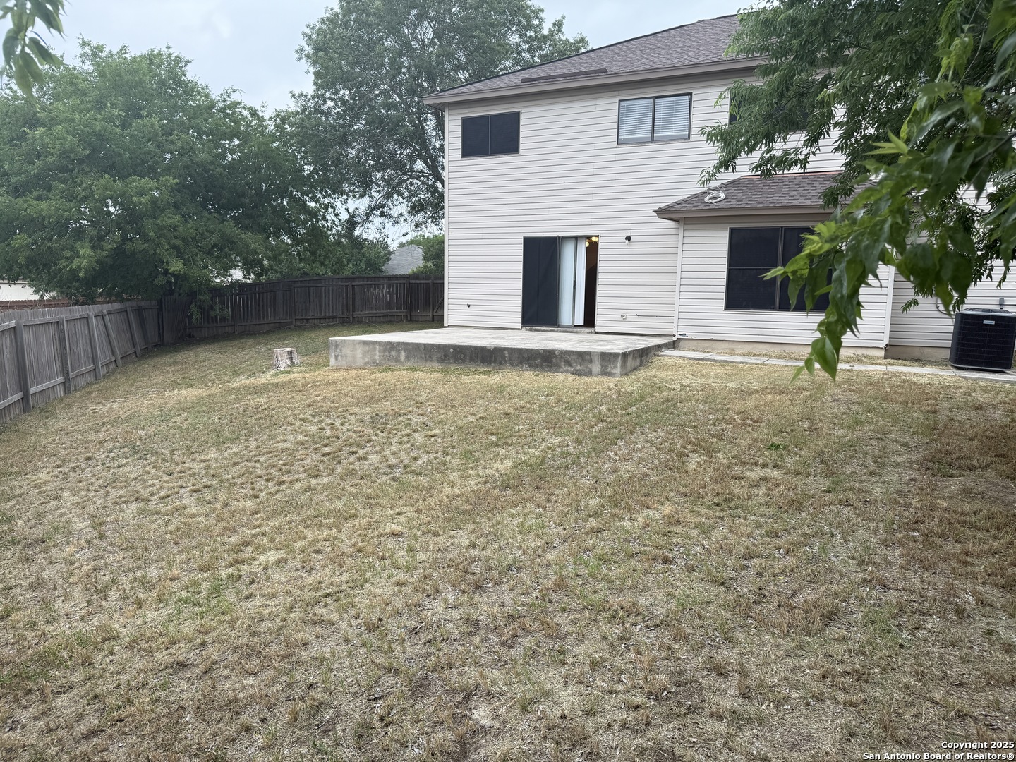 8022 Chestnut Clay Lane Converse, TX 78109 - Photo 21 of 21 a backyard of a house with lots of green space