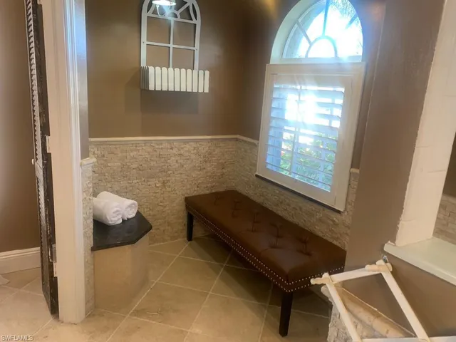 a bathroom with a toilet sink and window