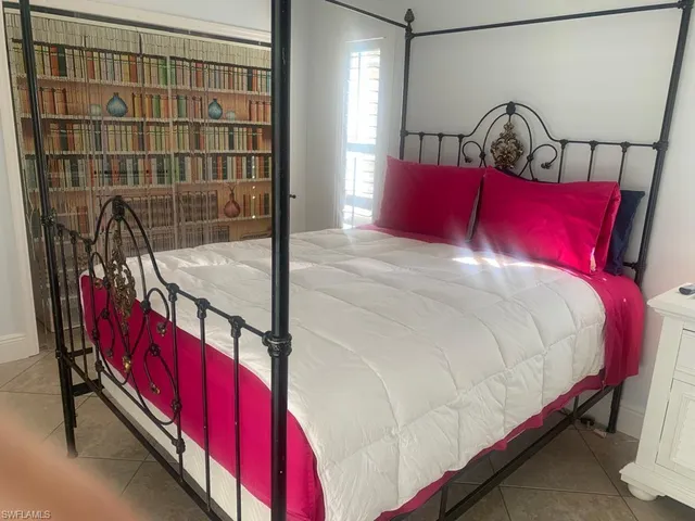 a white toilet sitting next to a bathroom sink and vanity