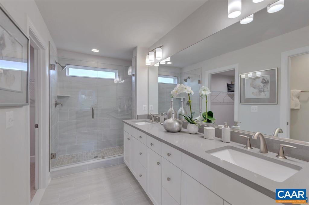2837 Rambling Brook Lane Crozet, VA 22932 - Photo 19 of 24 a bathroom with a granite countertop double vanity sink mirror shower and double