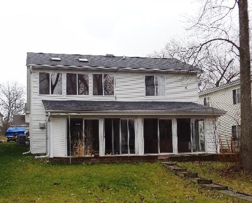 35476 North Wilson Road Ingleside, IL 60041 - Photo 1 of 12 a front view of a house with a yard and garage