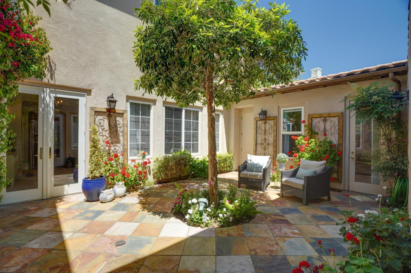 2860 Club Drive Gilroy, CA 95020 - Photo 17 of 87 a view of a patio with couches table and chairs and potted plants