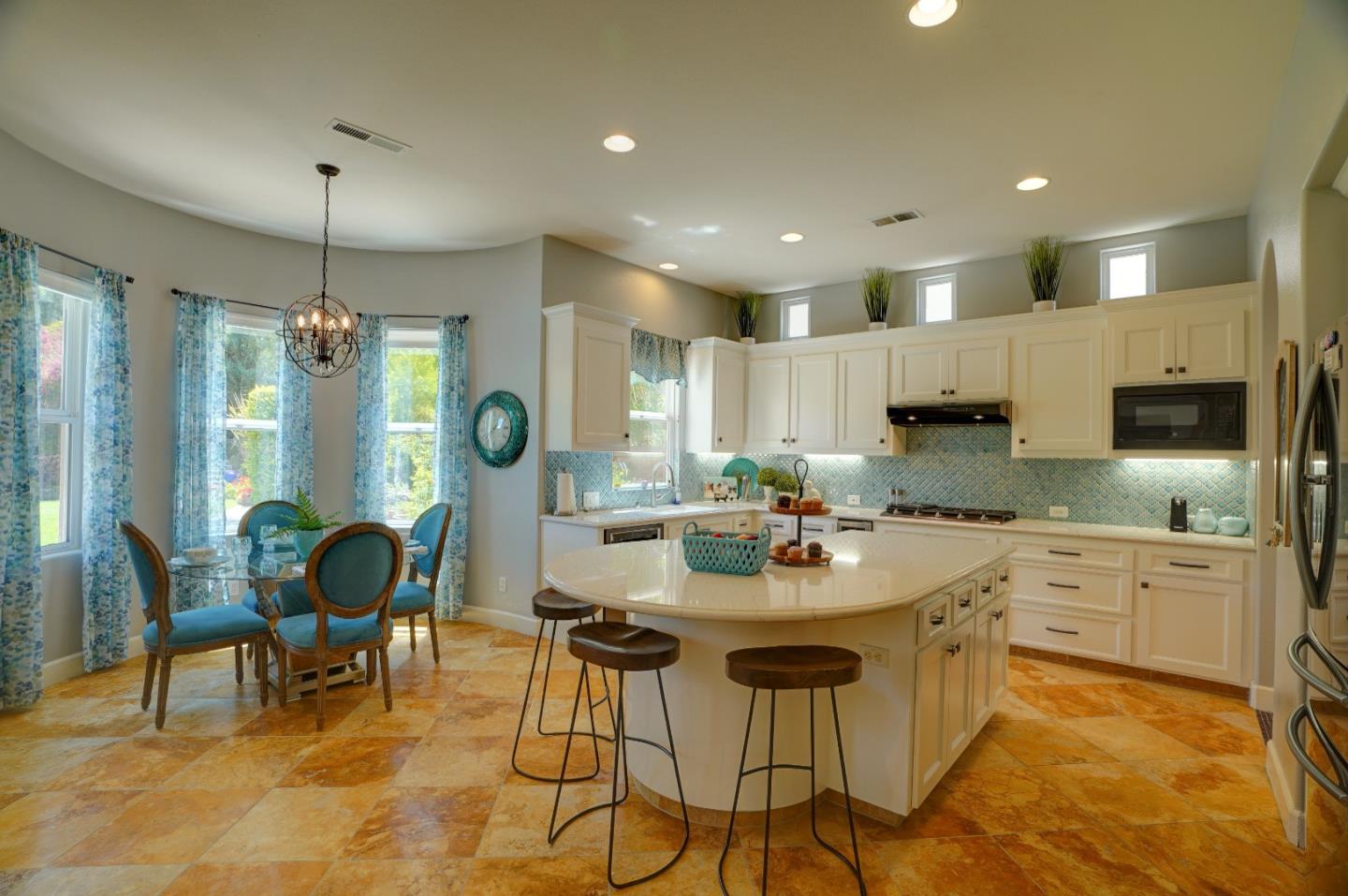 2860 Club Drive Gilroy, CA 95020 - Photo 20 of 87 a kitchen with kitchen island granite countertop a table and chairs in it