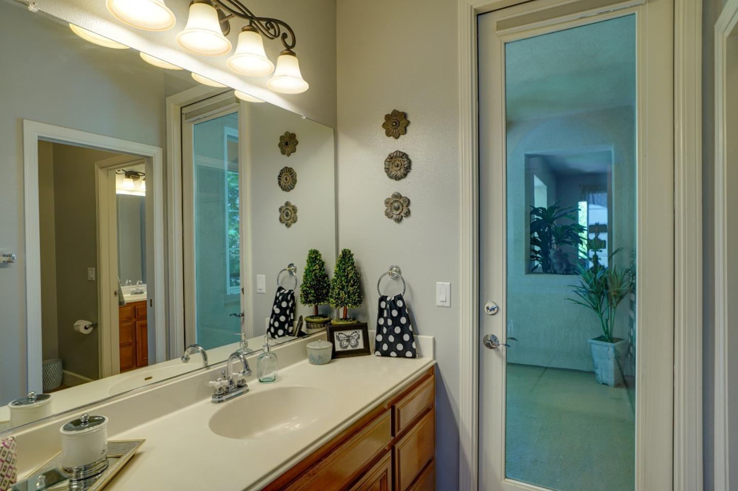 2860 Club Drive Gilroy, CA 95020 - Photo 44 of 87 a bathroom with a sink and a mirror