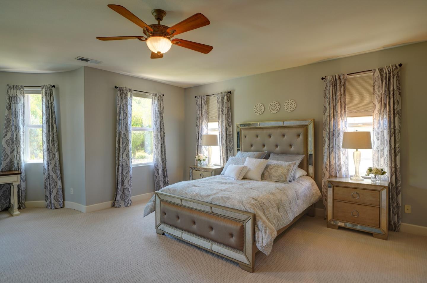 2860 Club Drive Gilroy, CA 95020 - Photo 54 of 87 a bedroom with a bed and a chandelier