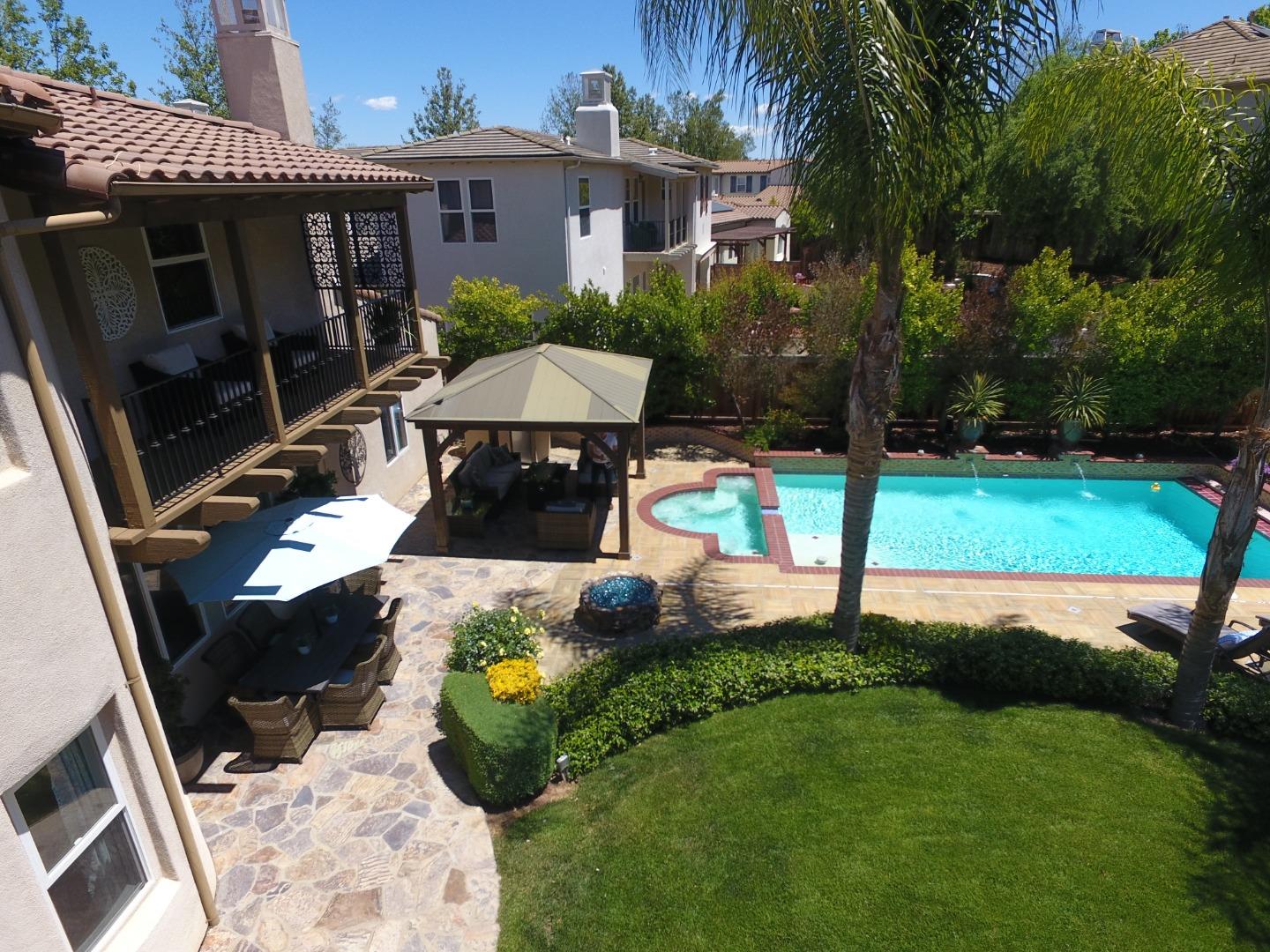 2860 Club Drive Gilroy, CA 95020 - Photo 58 of 87 a view of a house with backyard sitting area and swimming pool