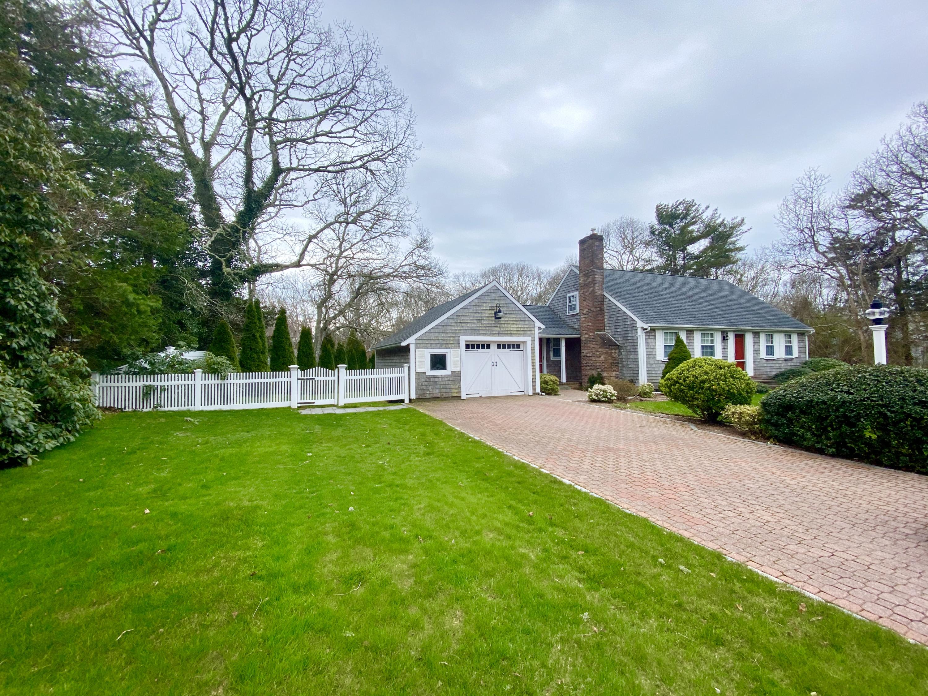 12 Nemasket Road Falmouth, MA 02540 - Photo 2 of 23 a front view of house with yard and green space