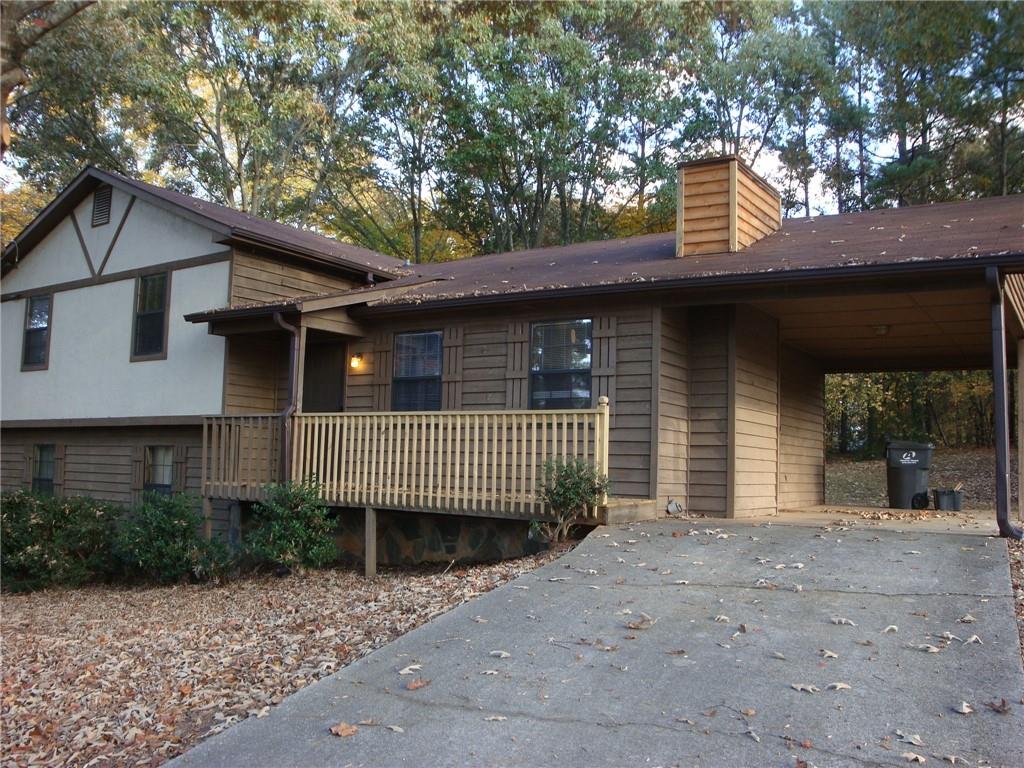 568 Russell Road Lawrenceville, GA 30043 - Photo 17 of 20 a front view of a house with a garden