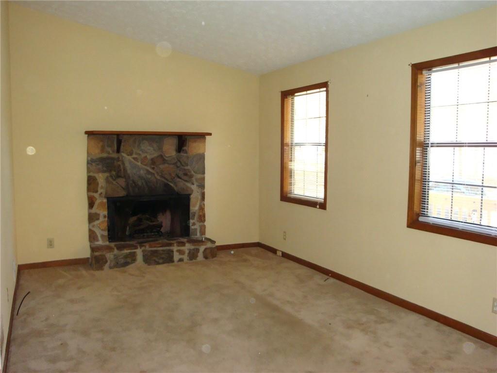 568 Russell Road Lawrenceville, GA 30043 - Photo 7 of 20 an empty room with windows