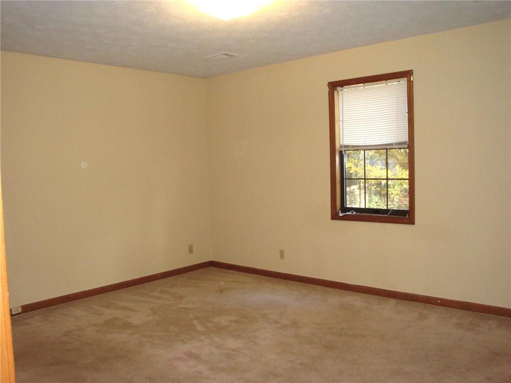 568 Russell Road Lawrenceville, GA 30043 - Photo 9 of 20 an empty room with a window