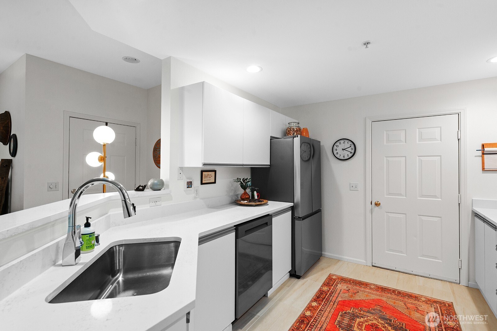 5319 South 236th Street, Unit 6 Kent, WA 98032 - Photo 11 of 29 a kitchen with a sink and a refrigerator