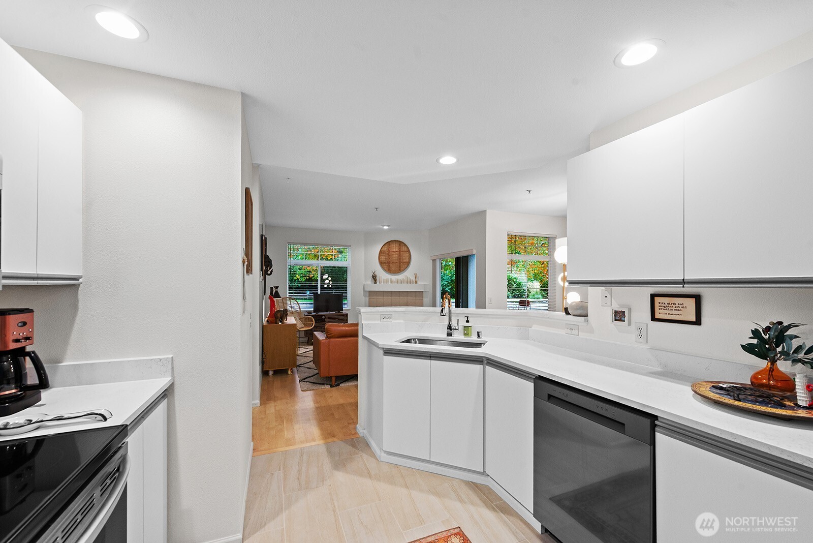 5319 South 236th Street, Unit 6 Kent, WA 98032 - Photo 13 of 29 a kitchen with a sink stove and cabinets