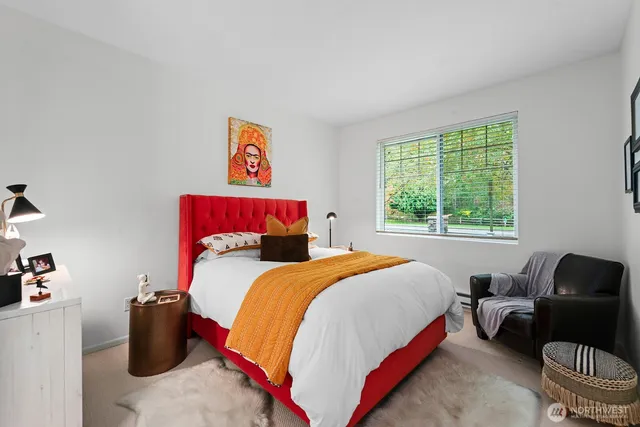 a bedroom with a bed and a couch