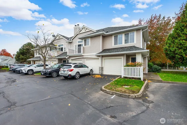 a view of a car park in front of a house