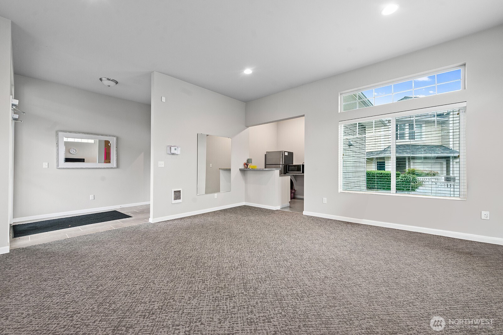 5319 South 236th Street, Unit 6 Kent, WA 98032 - Photo 27 of 29 a view of empty room with a kitchen and a window