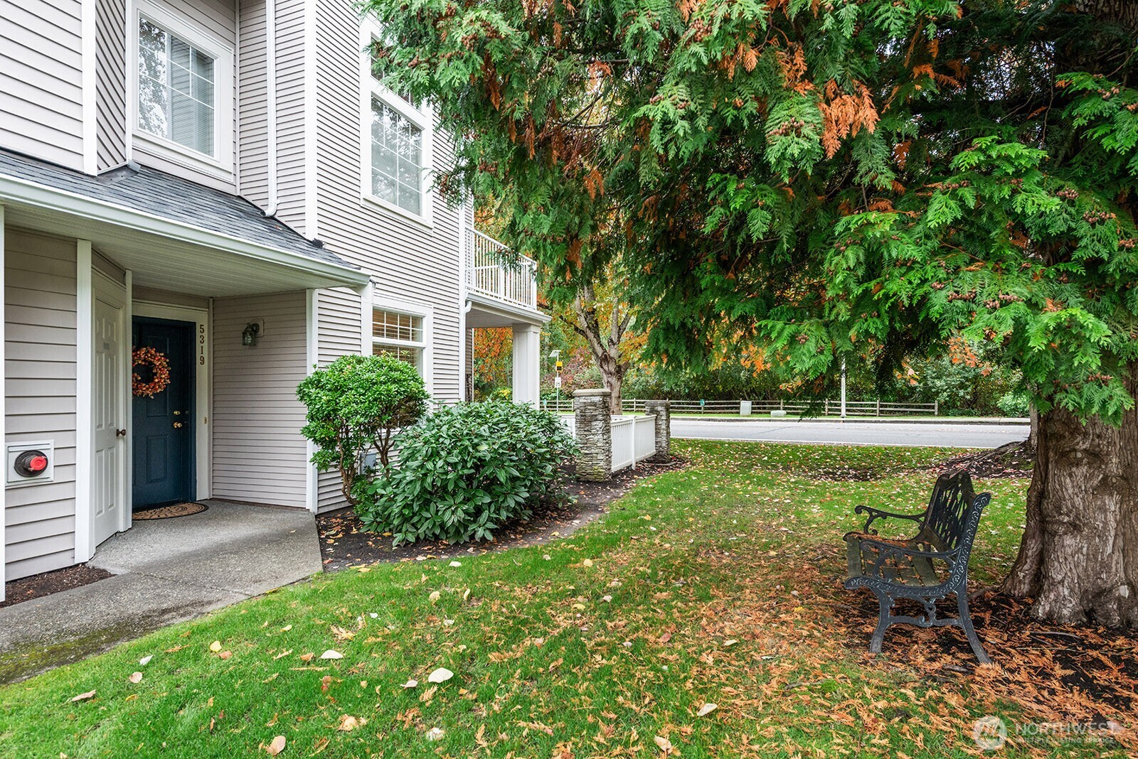 5319 South 236th Street, Unit 6 Kent, WA 98032 - Photo 28 of 29 a view of backyard with potted plants and large trees