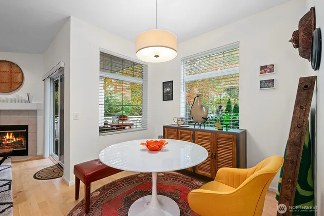 a view of a dining room with furniture window and wooden floor