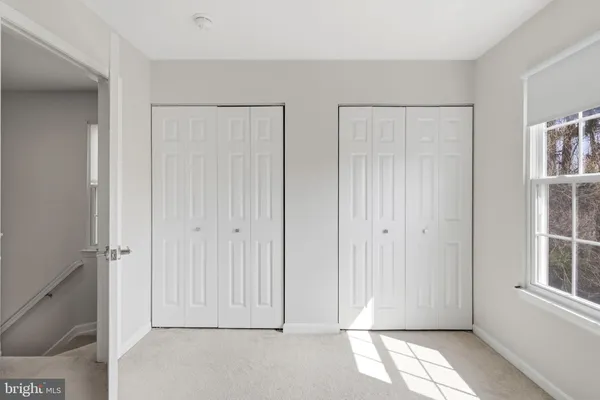 a view of empty room with windows