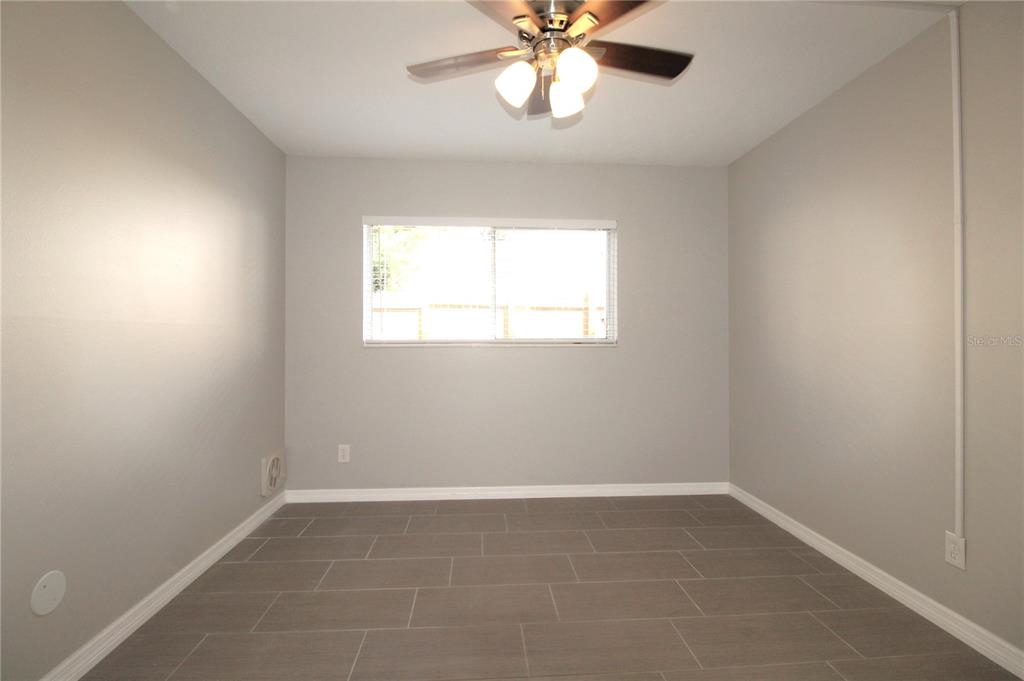 3001 Bee Ridge Road, Unit 121 Sarasota, FL 34239 - Photo 6 of 19 an empty room with a window