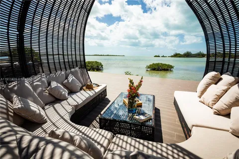 a view of swimming pool with lake view and mountain in back