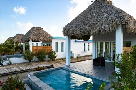 a bedroom with a bed and glass window