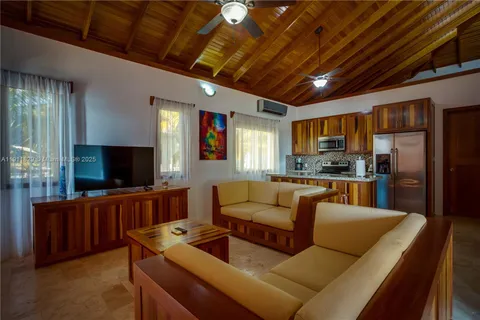 a bathroom with a granite countertop sink a mirror and shower