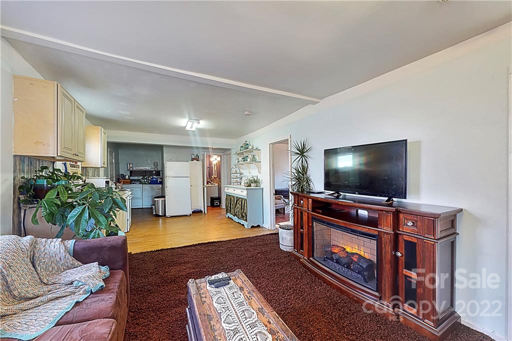 722 Morningside Road, Unit 97 Charlotte, NC 28214 - Photo 8 of 18 a living room with furniture and a flat screen tv