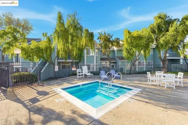 a view of a backyard with a patio