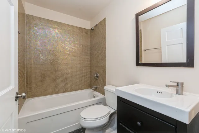 a bathroom with a sink a toilet and a bathtub