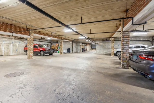 a view of a cars park in front of garage