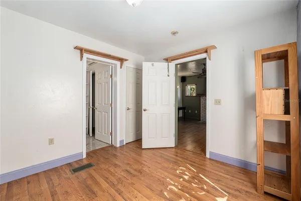 a view of a livingroom with furniture and hardwood floor
