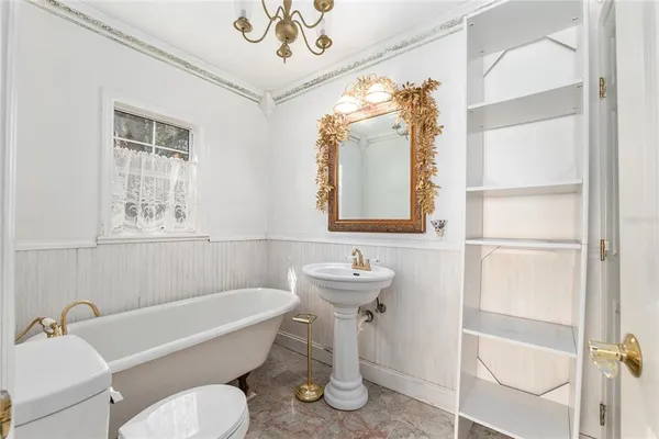 a living room with lots of furniture and gym equipment