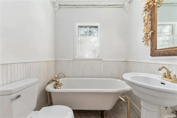 a living room with lots of furniture and air hockey table