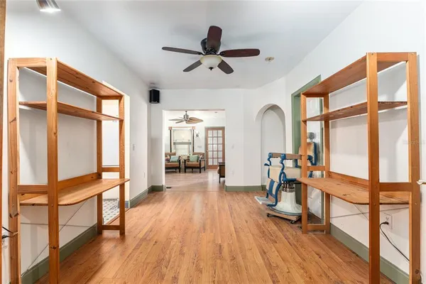 a view of kitchen with furniture and wooden floor