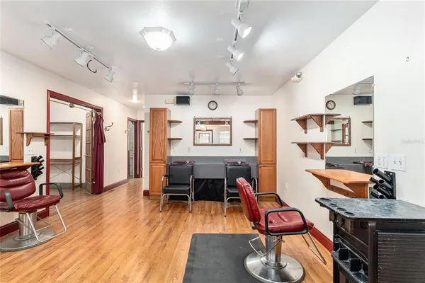 a kitchen with a sink stove top oven and refrigerator