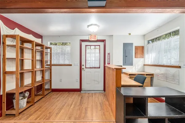 a kitchen with granite countertop a sink stove and cabinets