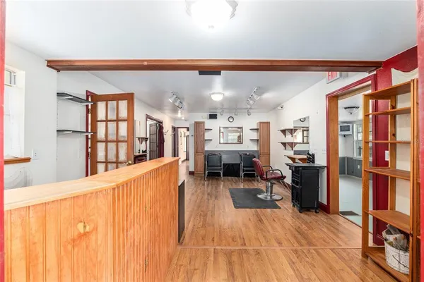 a view of a room with gym equipment and equipment
